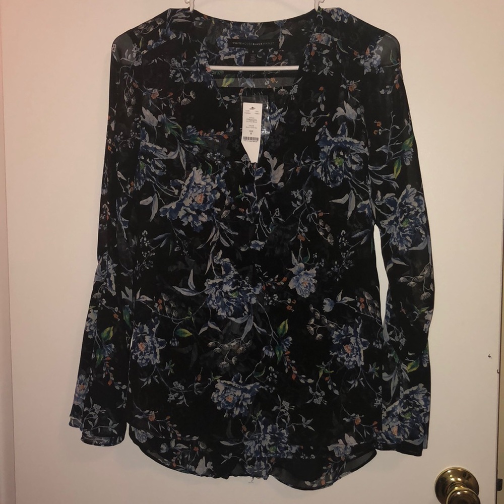 Black floral dress top with bell button sleeves.
